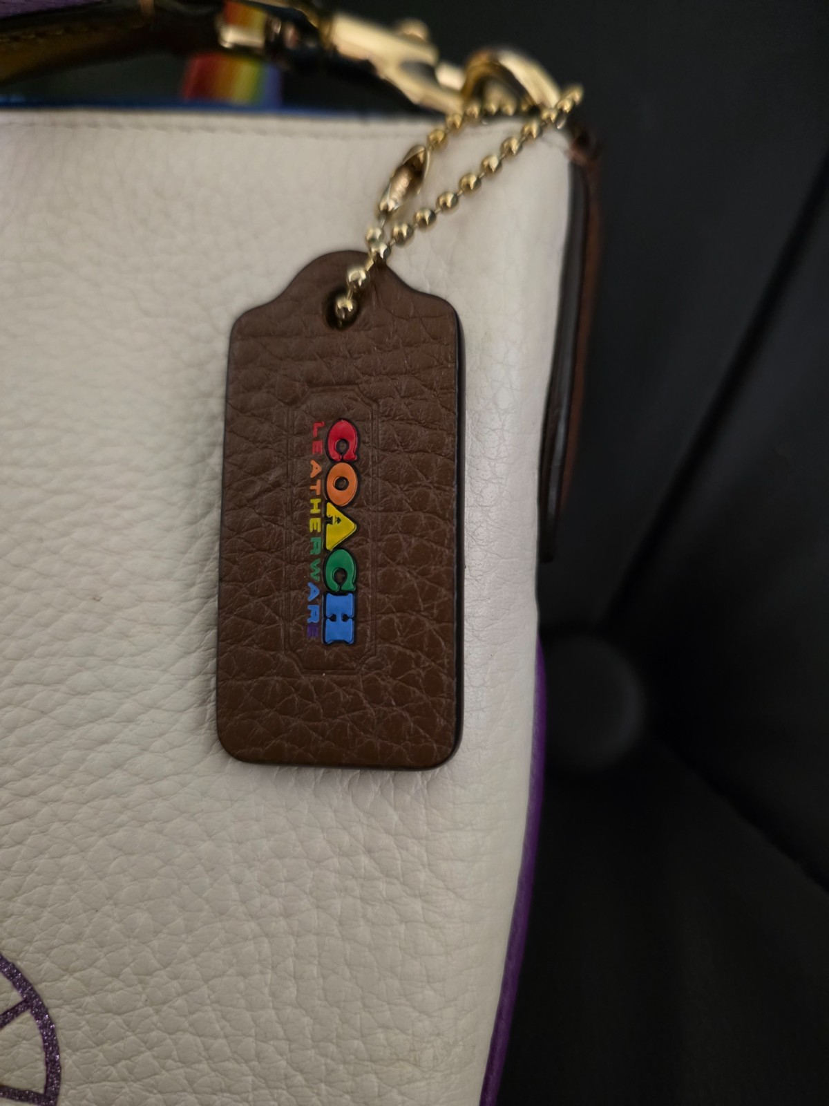 Coach Jes Slim crossbody bag in chalk leather featuring a rainbow carriage