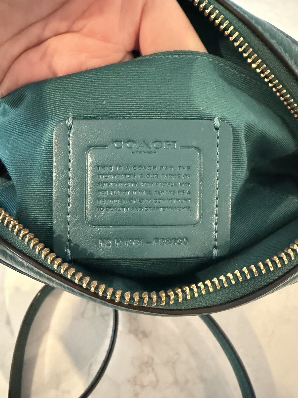 Coach teal Pebbled Leather Crossbody With Gold Studded Script Logo