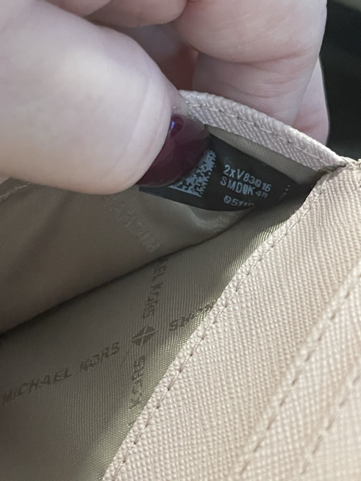 light pink michael kors purse and wallet