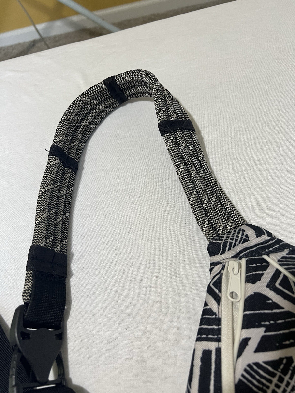 Kavu Rope Sling bag in a black and white geometric pattern