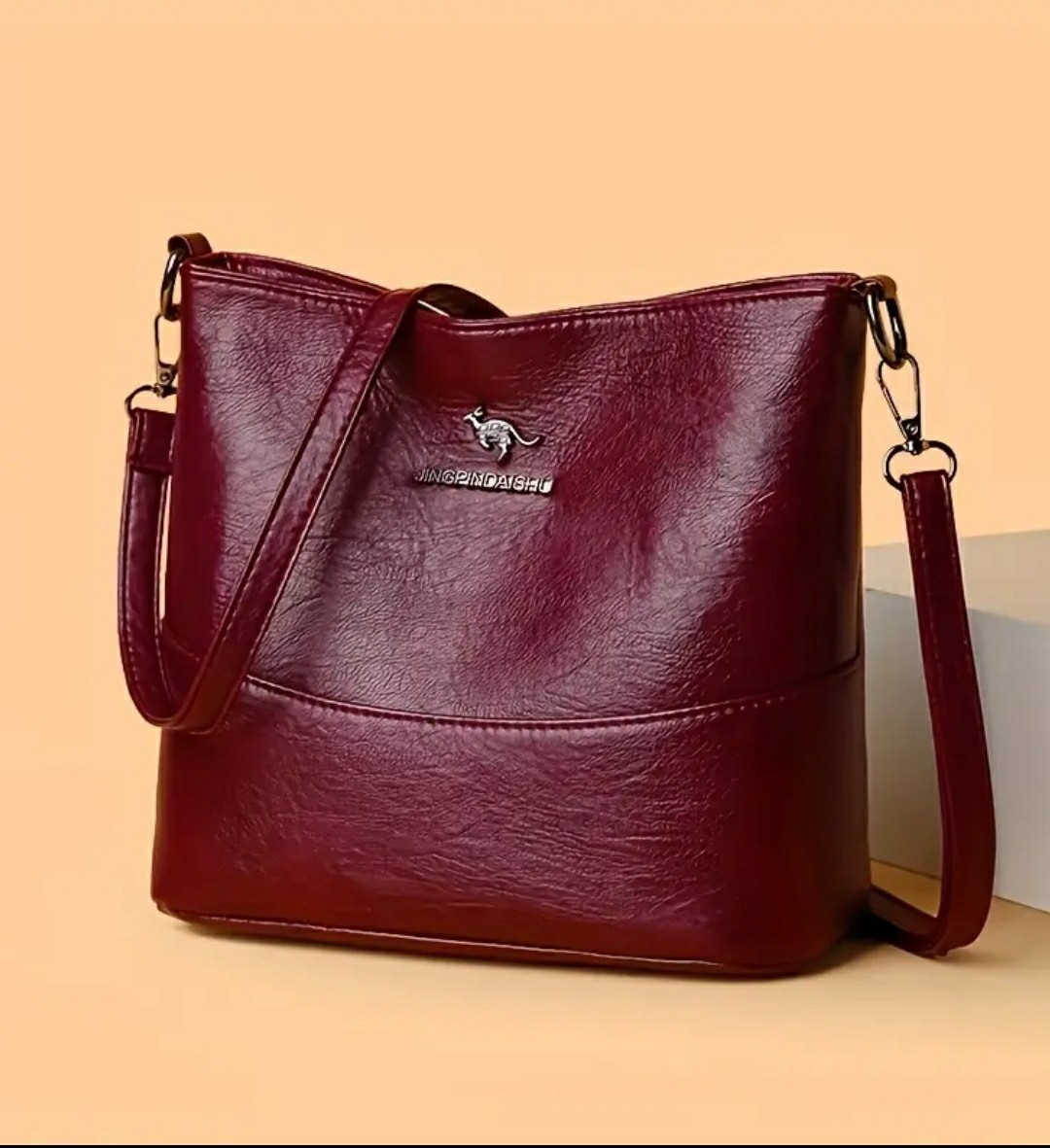 Adjustable Crossbody Bag, Zipper Closure, Stylish City Accessory.