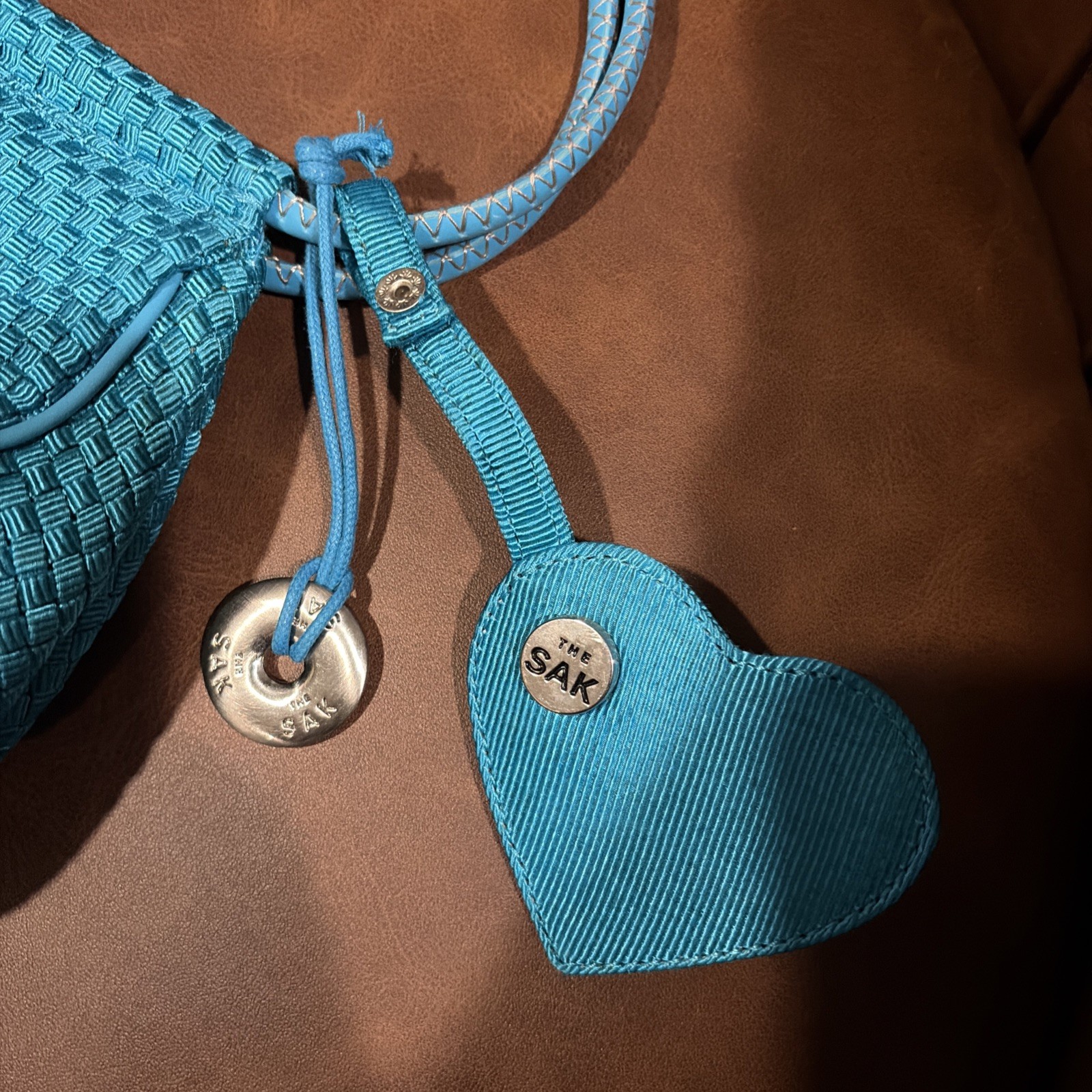 The Sak Mini Shoulder Bag woven w vegan leather trim turquoise heart