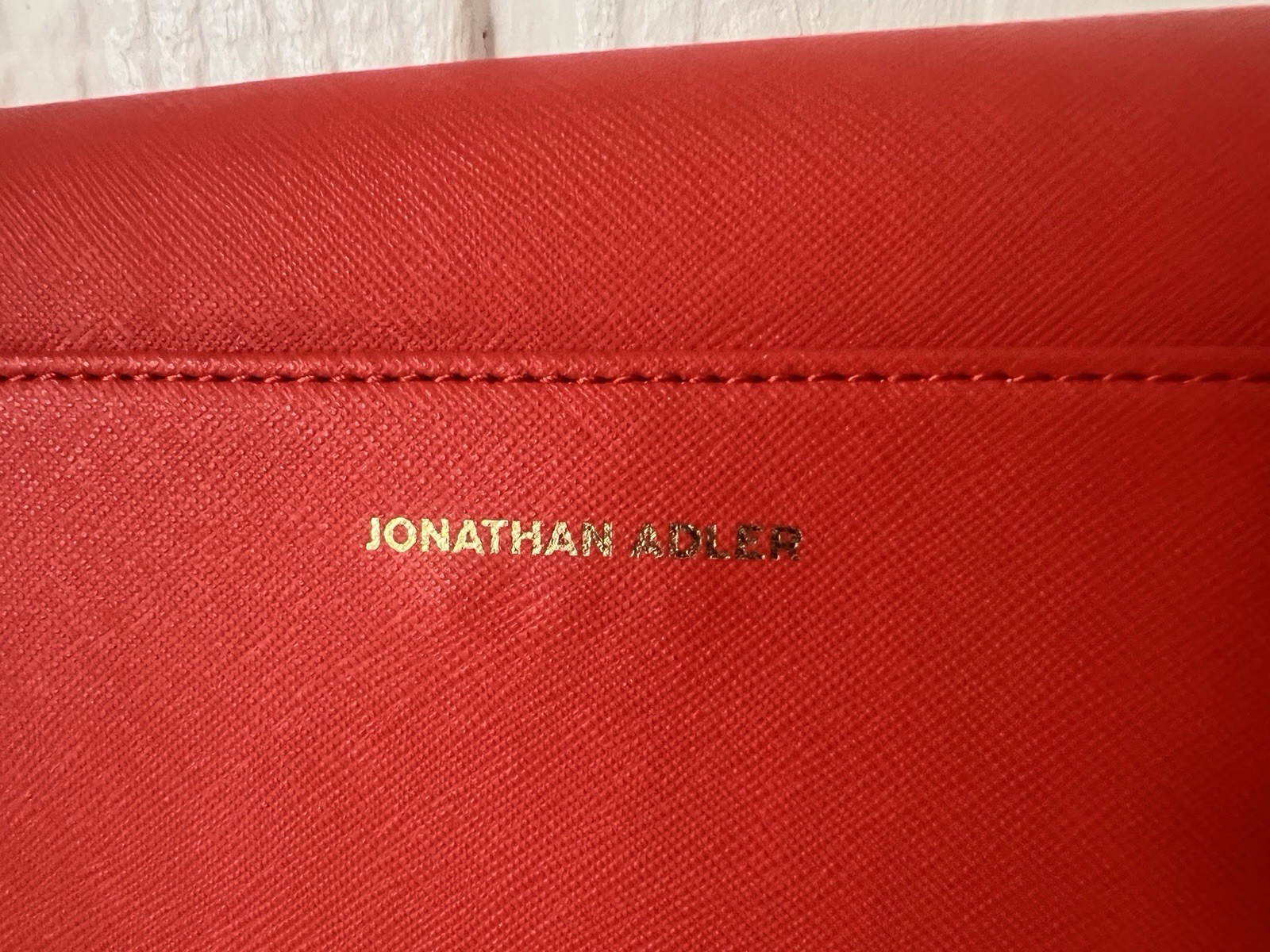 Jonathan Alder red YES clutch purse