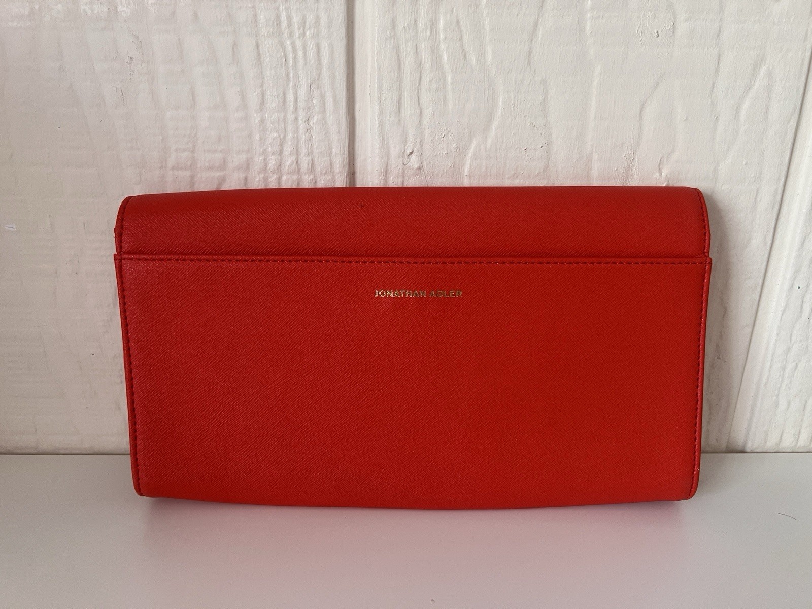 Jonathan Alder red YES clutch purse