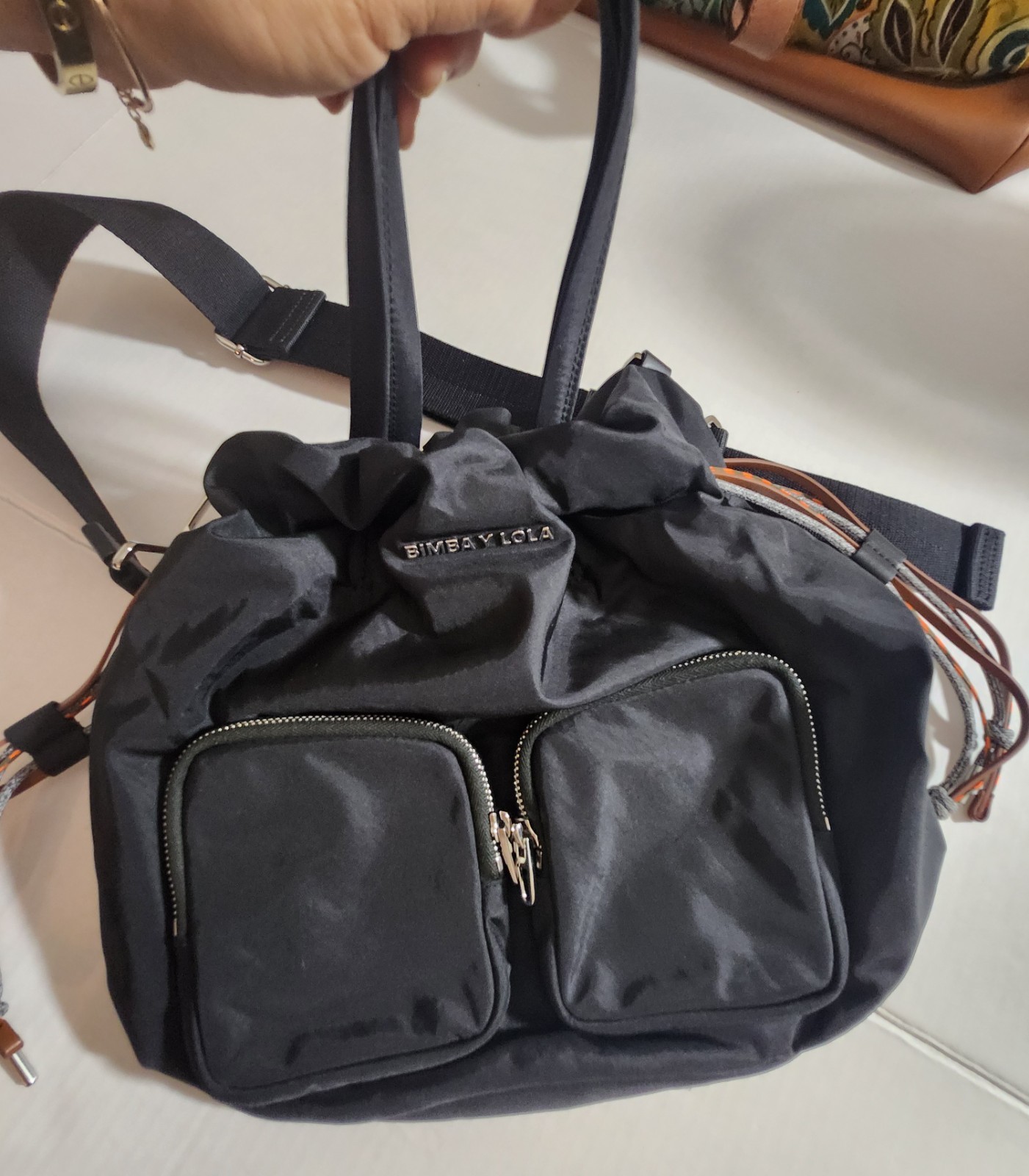 BIMBA Y LOLA Black Drawstring Bag Silver Hardware Logo Front Zip Pockets Strap