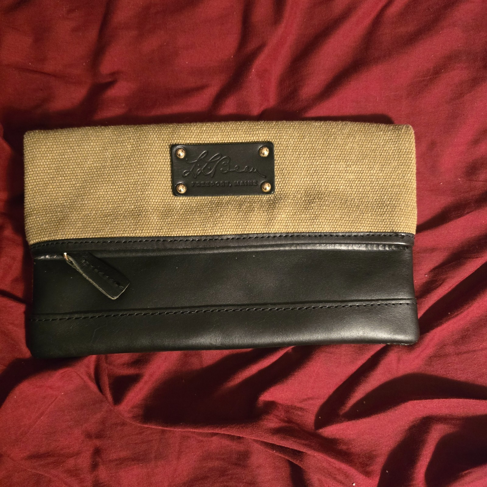L.L. Bean Freeport, Maine canvas and leather fold-over clutch wallet.