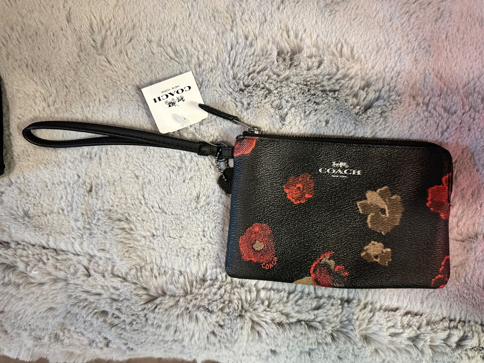 Brand new coach black floral wristlet for any occassion