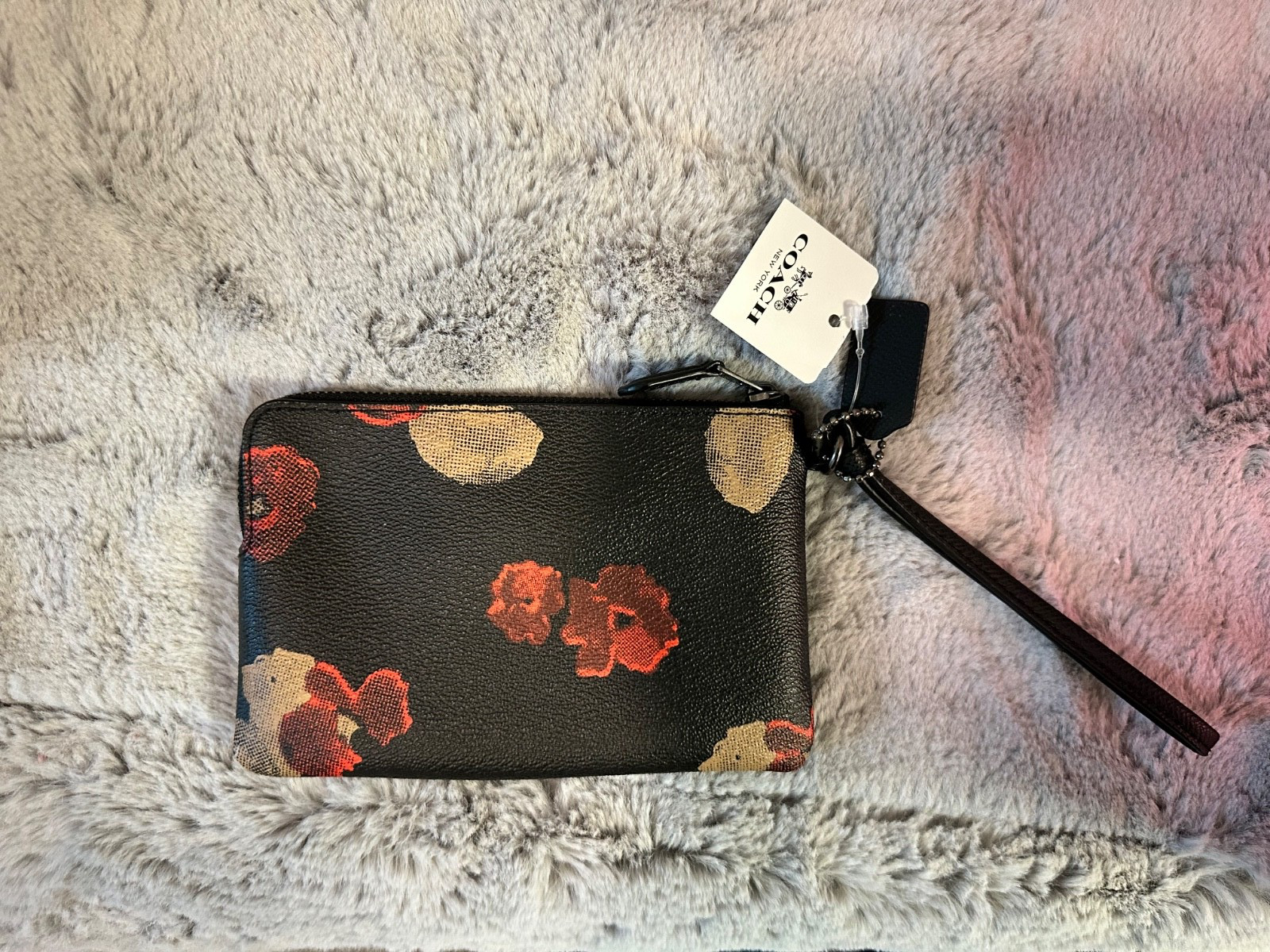 Brand new coach black floral wristlet for any occassion