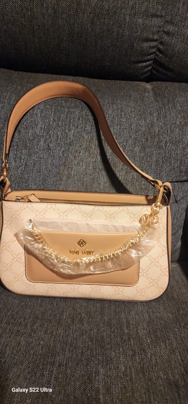 Nine west Beige Logo Shoulder Bag w/gold chain strap zip closure lined.