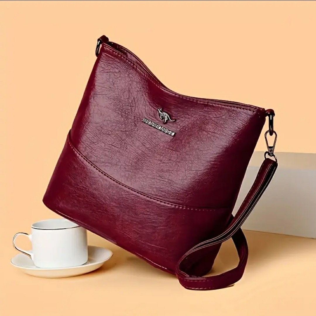 Adjustable Crossbody Bag, Zipper Closure, Stylish City Accessory.