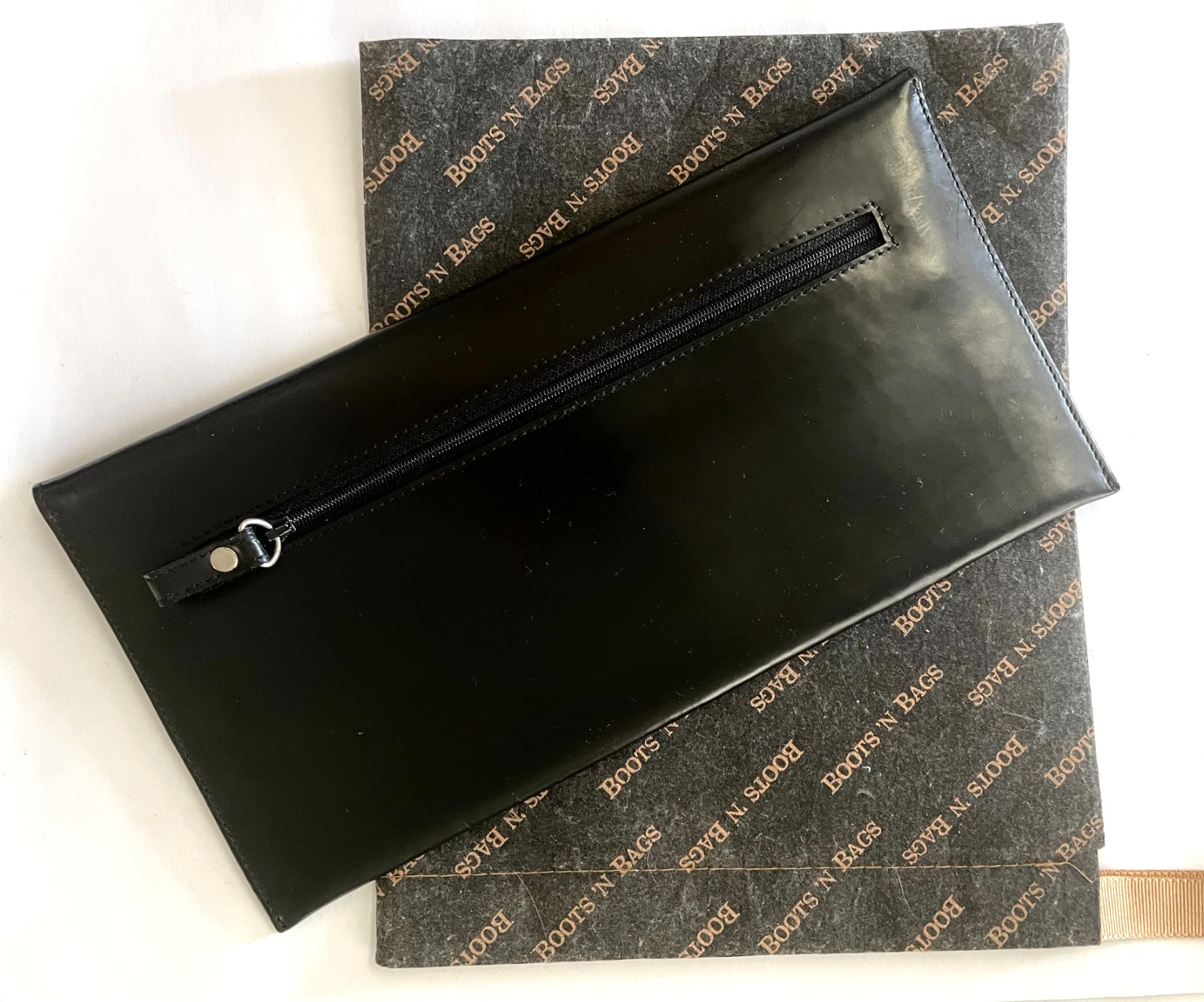 “Boots ‘N Bags” Vintage leather. Envelope, Wallet 2002. 10 1/5″ x 5 1/5″ black