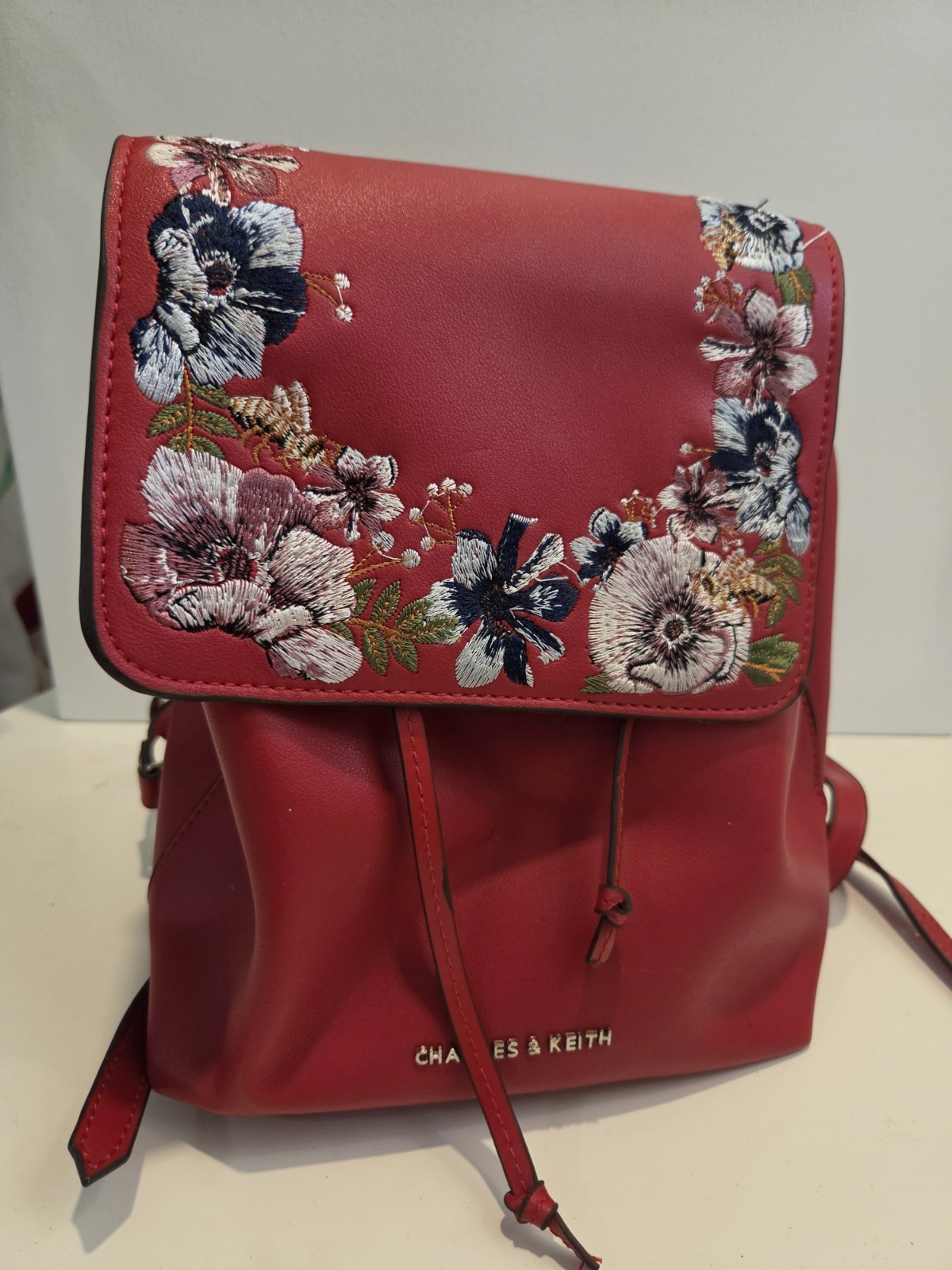 CHARLES & KEITH Women’s Red Floral Embroidered Backpack Drawstring Silver