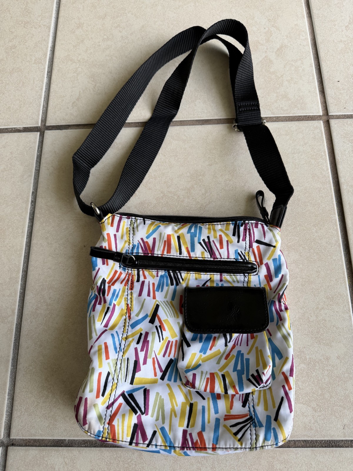 9 & Co. crossbody With outside zip pocket and outside snap pocket