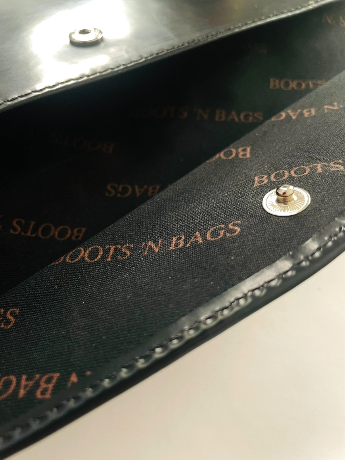 “Boots ‘N Bags” Vintage leather. Envelope, Wallet 2002. 10 1/5″ x 5 1/5″ black