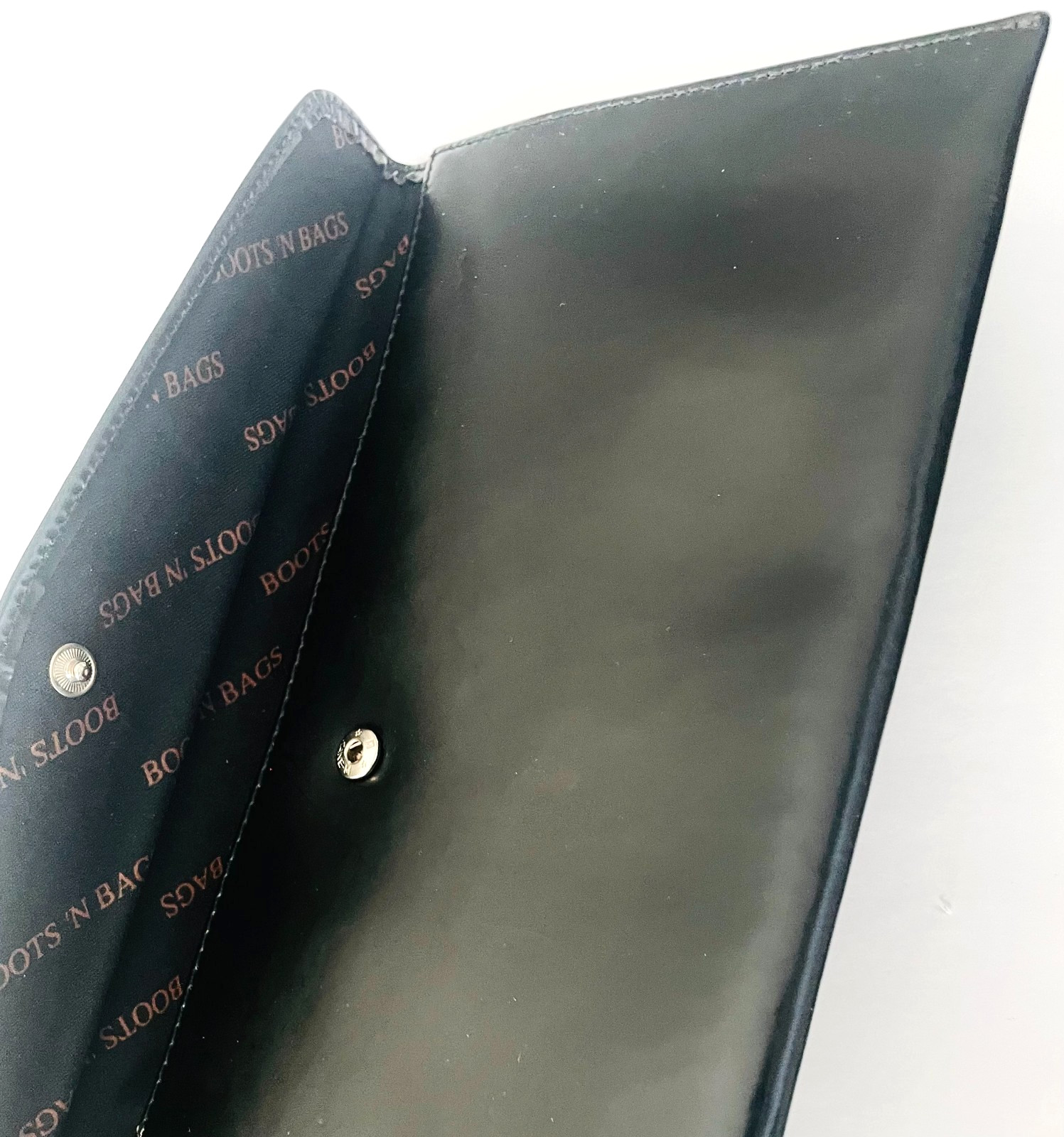 “Boots ‘N Bags” Vintage leather. Envelope, Wallet 2002. 10 1/5″ x 5 1/5″ black