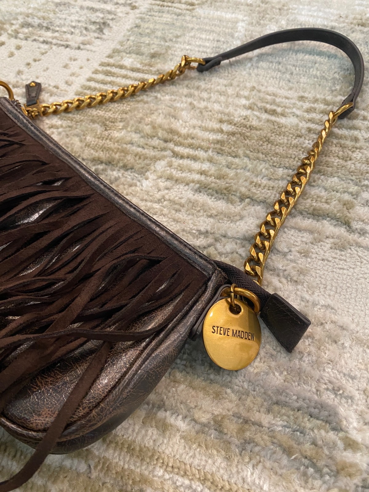 Steve Madden brown fringe crossbody bag accented with gold-tone hardware