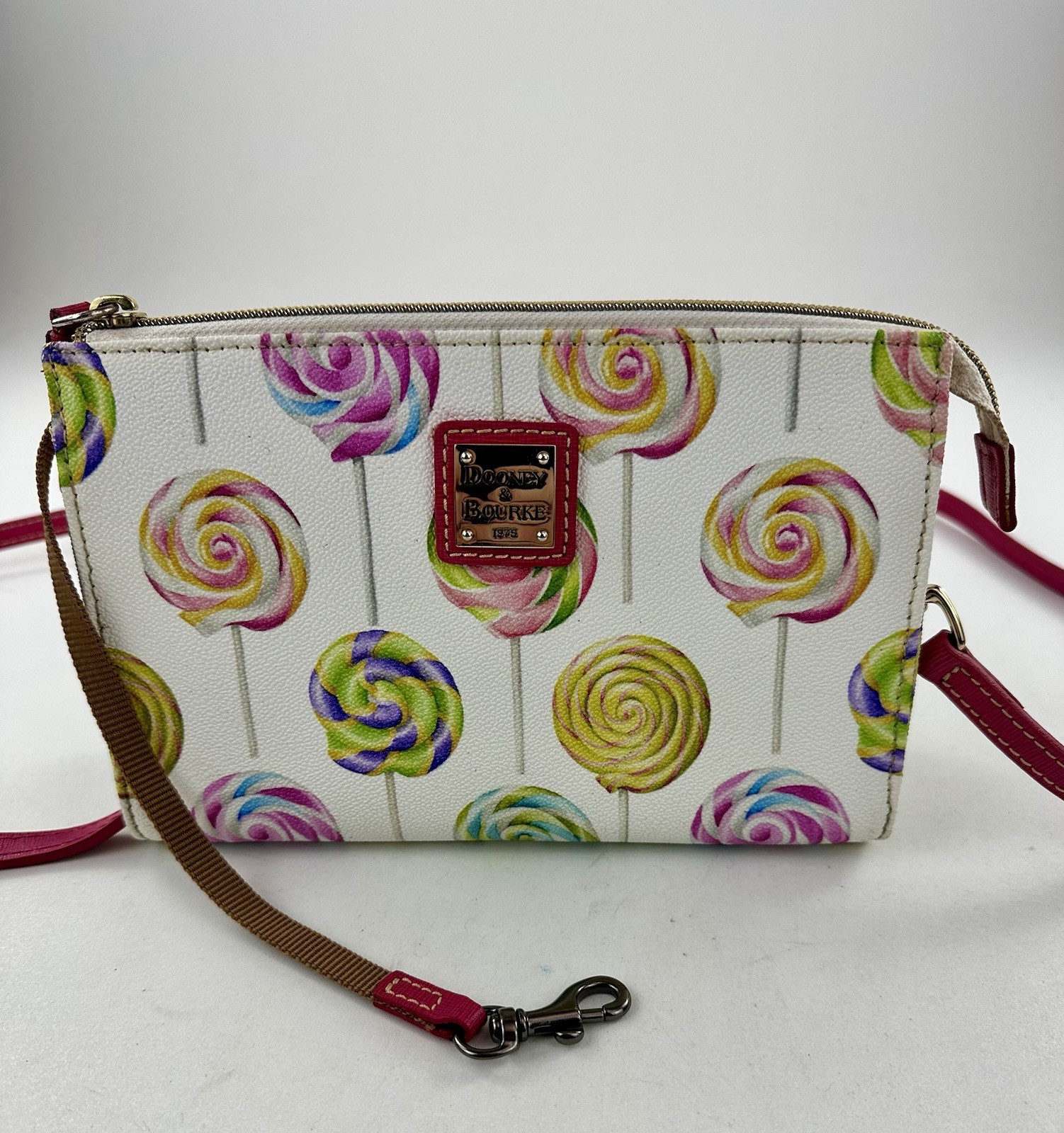 Dooney & Bourke Lollipop Swirl Crossbody Bag features a vibrant, candy-theme