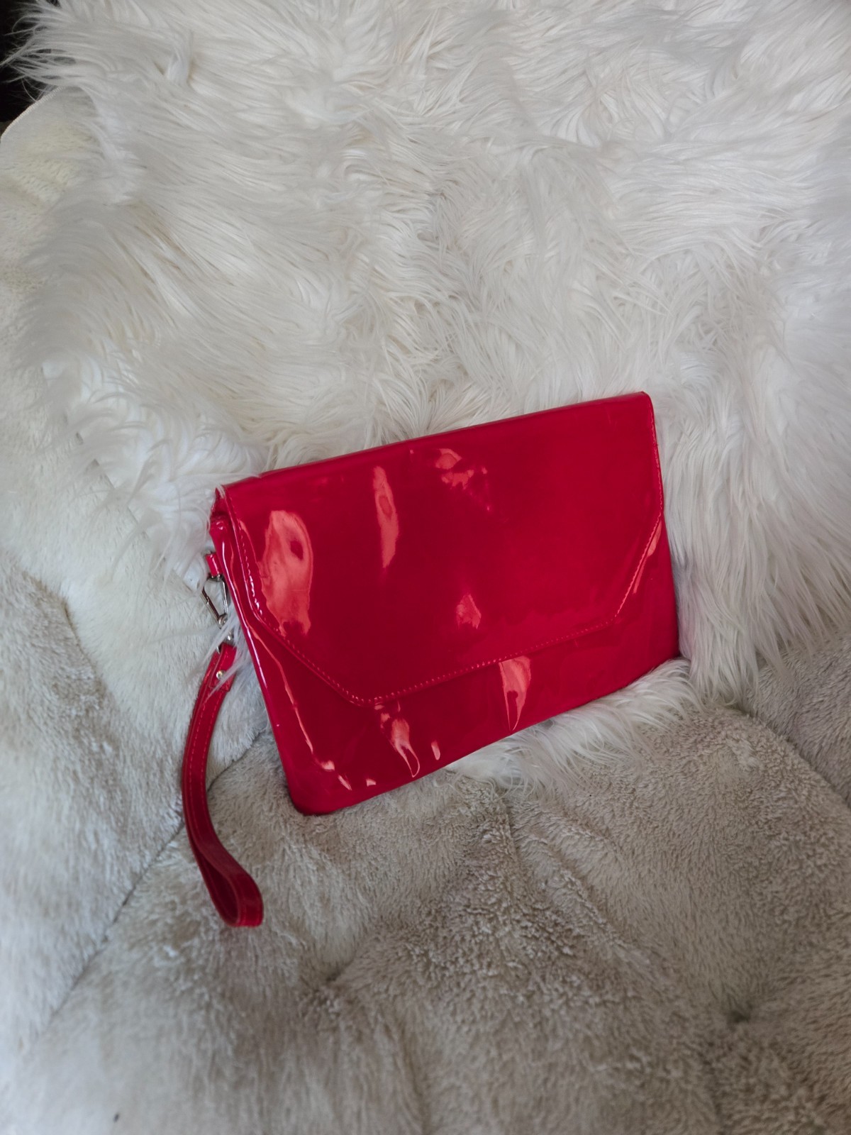 large red wristlet purse with two spacious compartments and magnetic snap