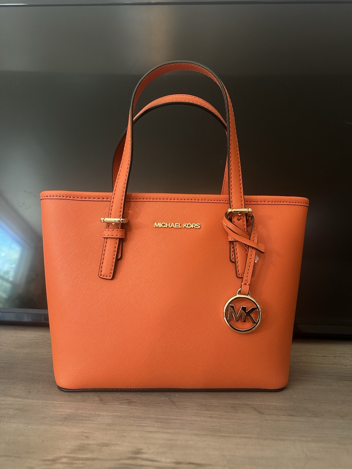 Michael Kors Orange saffiano Tote with MK Logo Charm