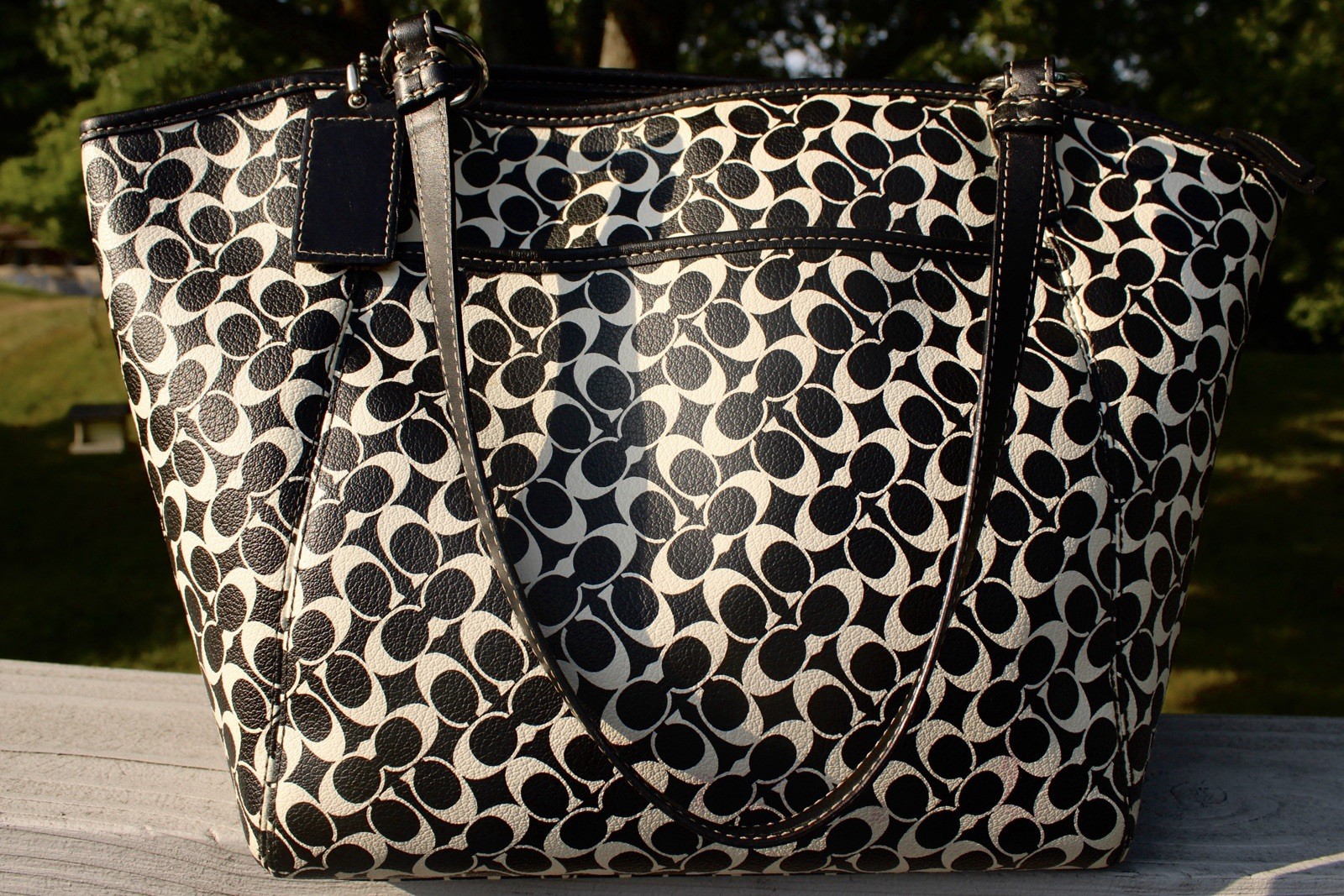 2000s Coach Black/White Op Art tote with silver turn-lock front pocket