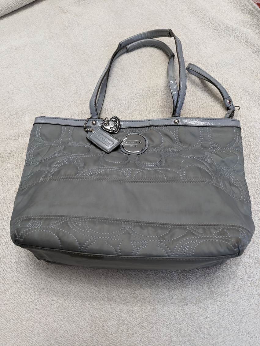 Coach purse. 13.5 x 9.5 inches. Quilted with leather trim.