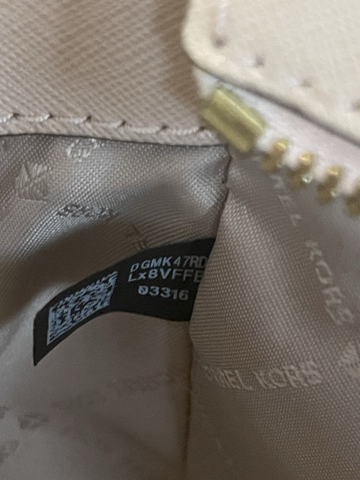 light pink michael kors purse and wallet