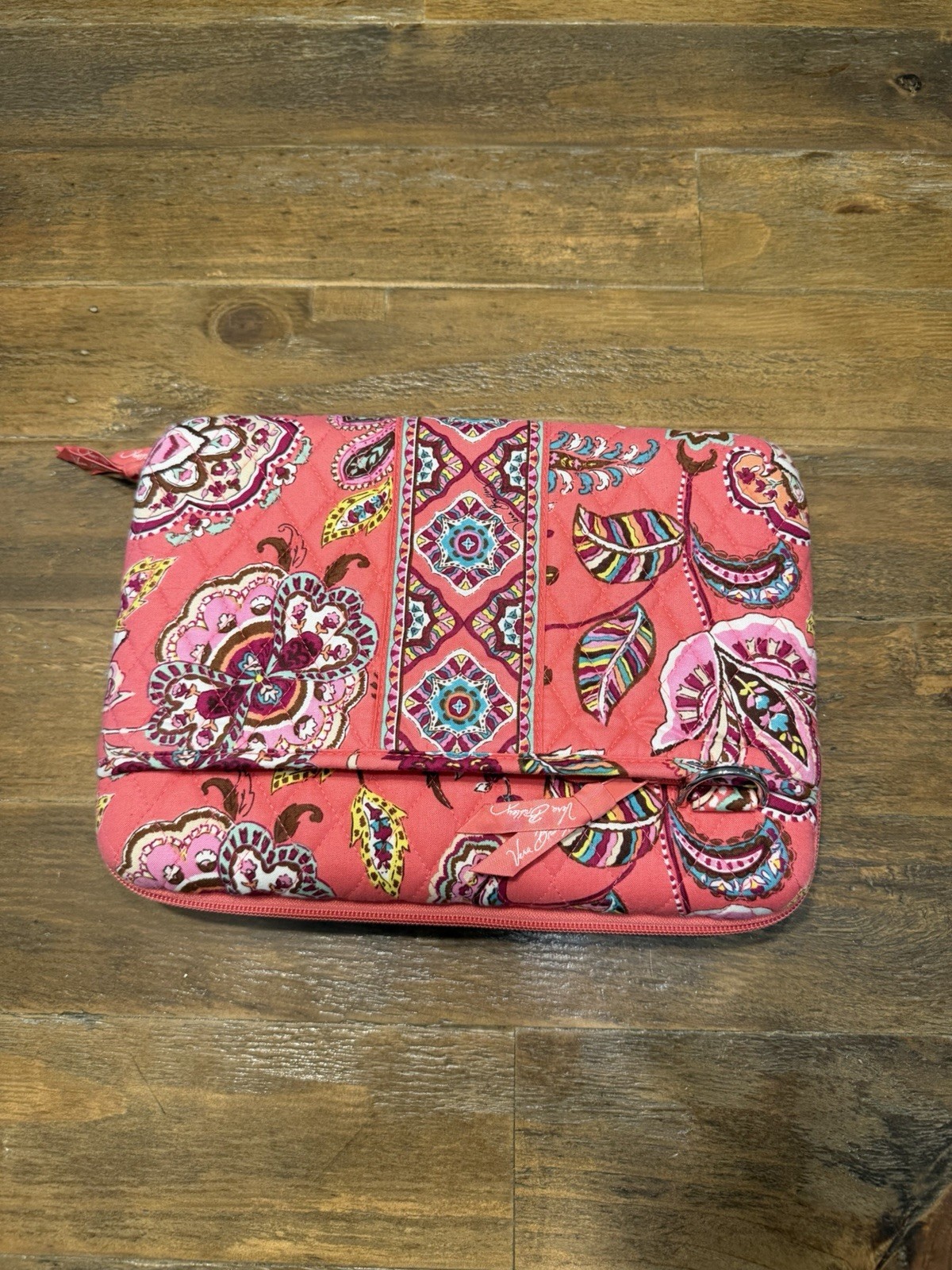 Vera Bradley hard shell laptop case features the “Call Me Coral” paisley pattern
