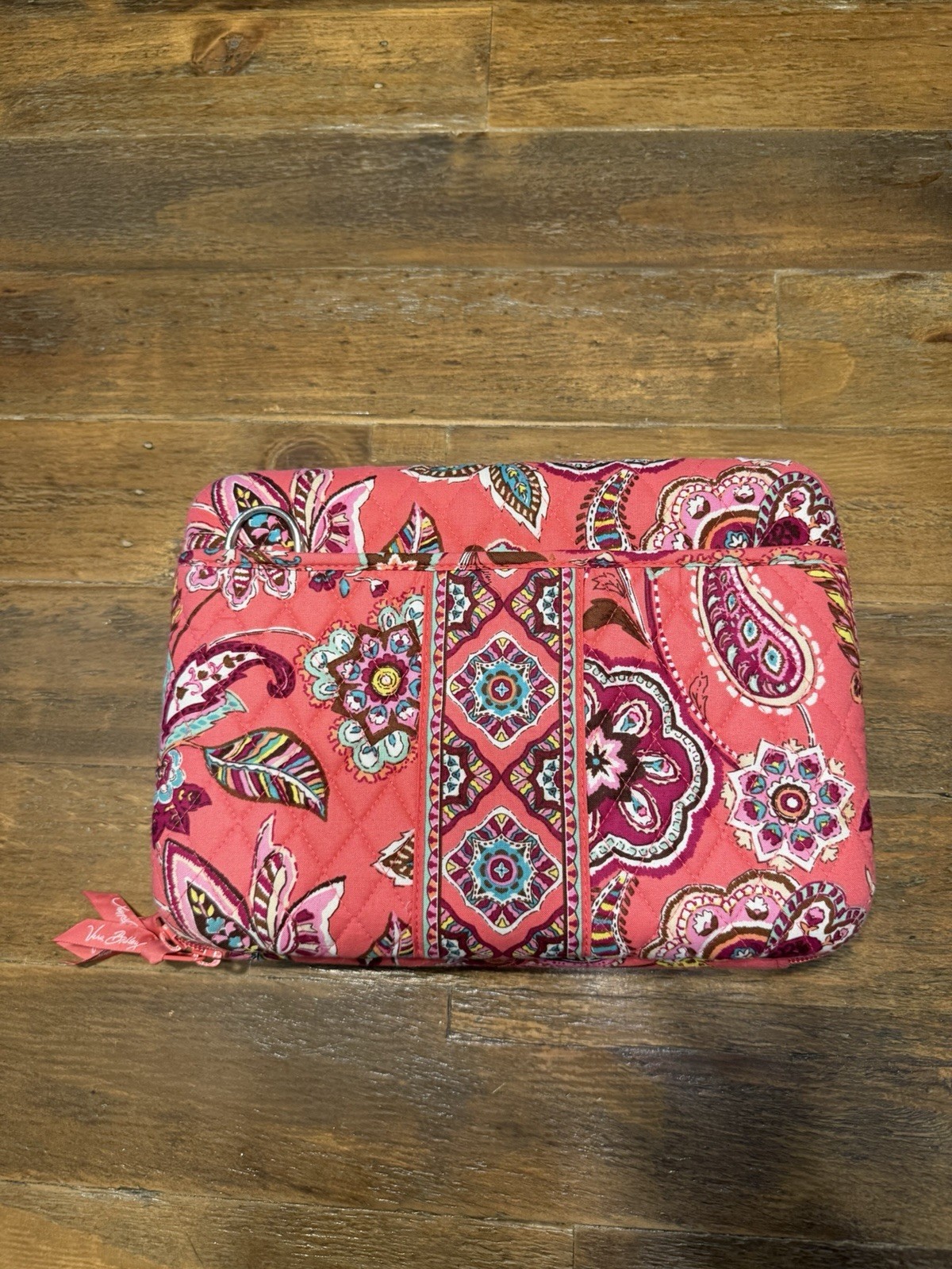 Vera Bradley hard shell laptop case features the “Call Me Coral” paisley pattern