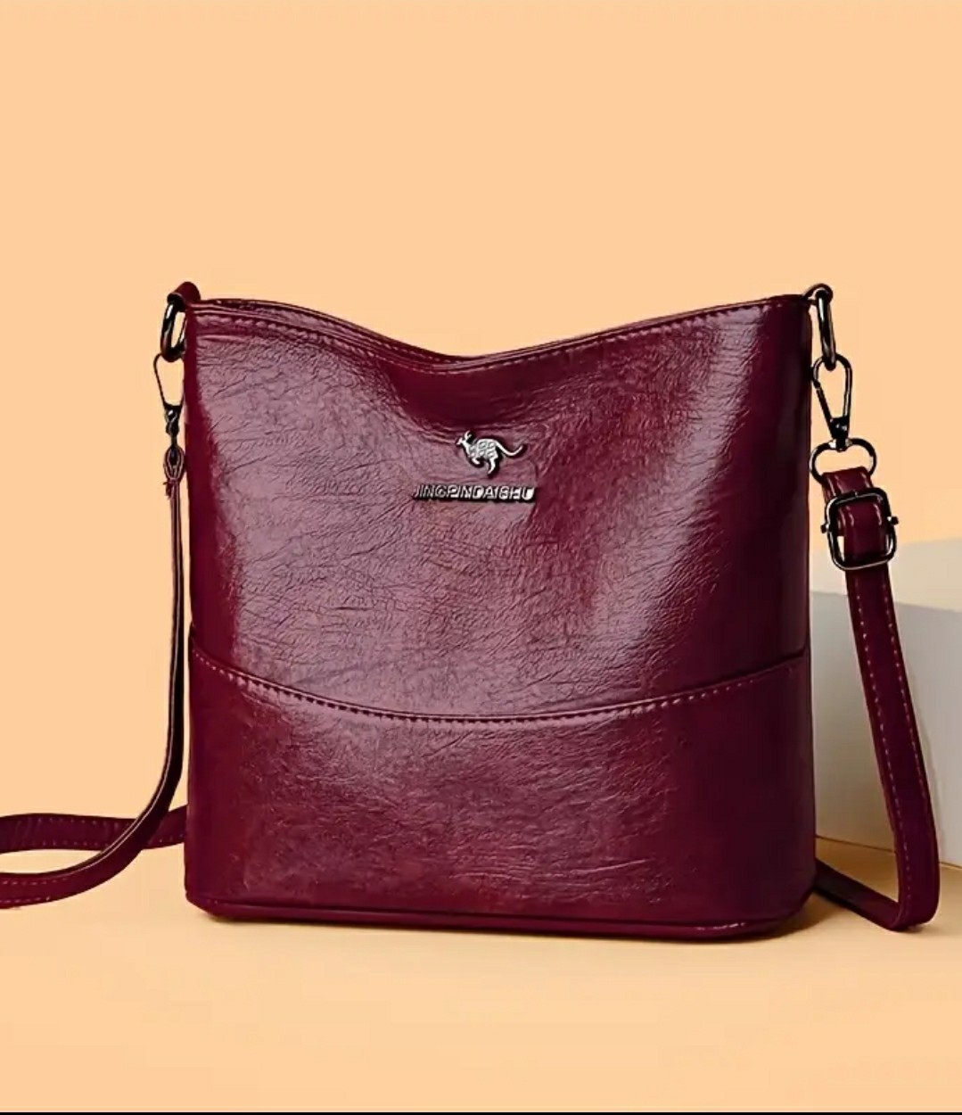 Adjustable Crossbody Bag, Zipper Closure, Stylish City Accessory.