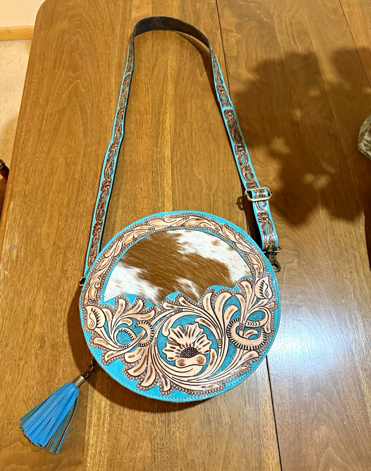 Myra Bag – Tooled brown and teal leather with cowhide accents