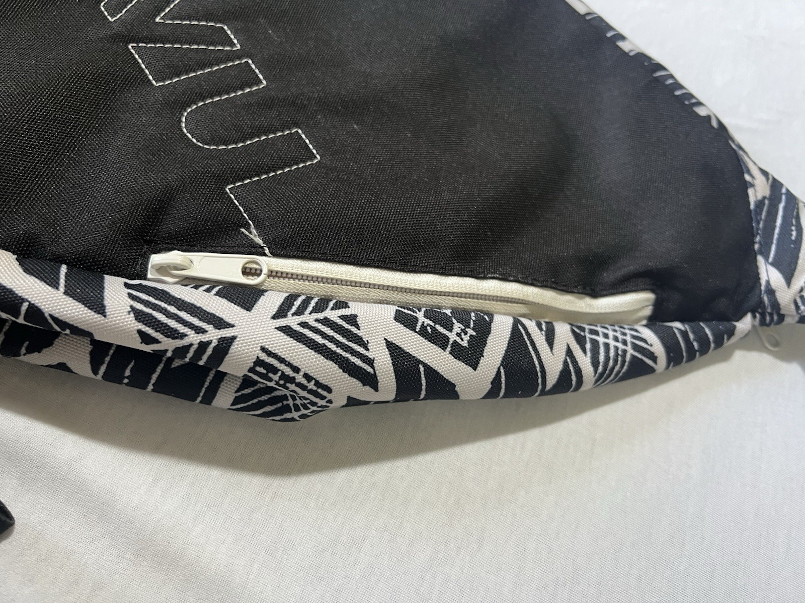 Kavu Rope Sling bag in a black and white geometric pattern