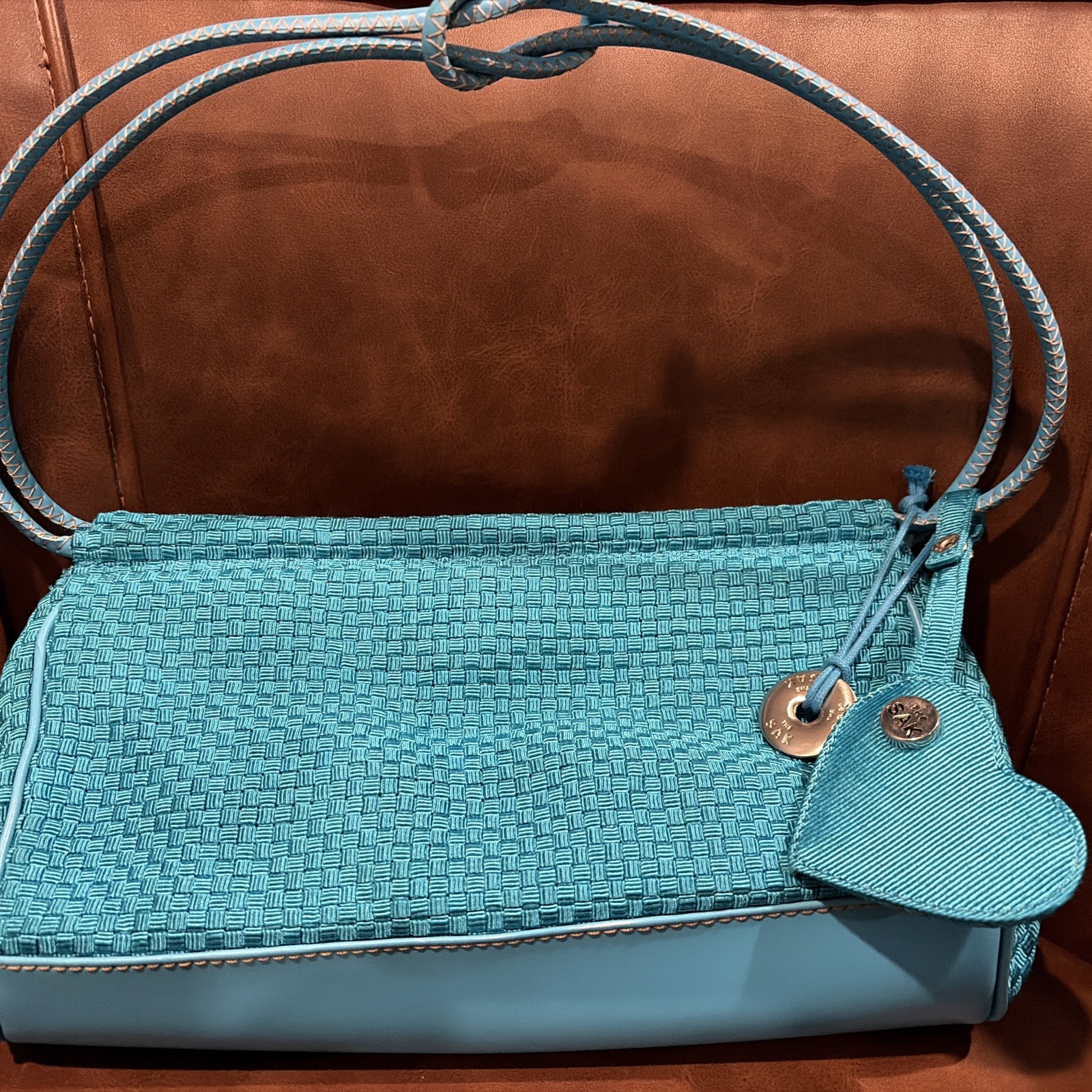 The Sak Mini Shoulder Bag woven w vegan leather trim turquoise heart