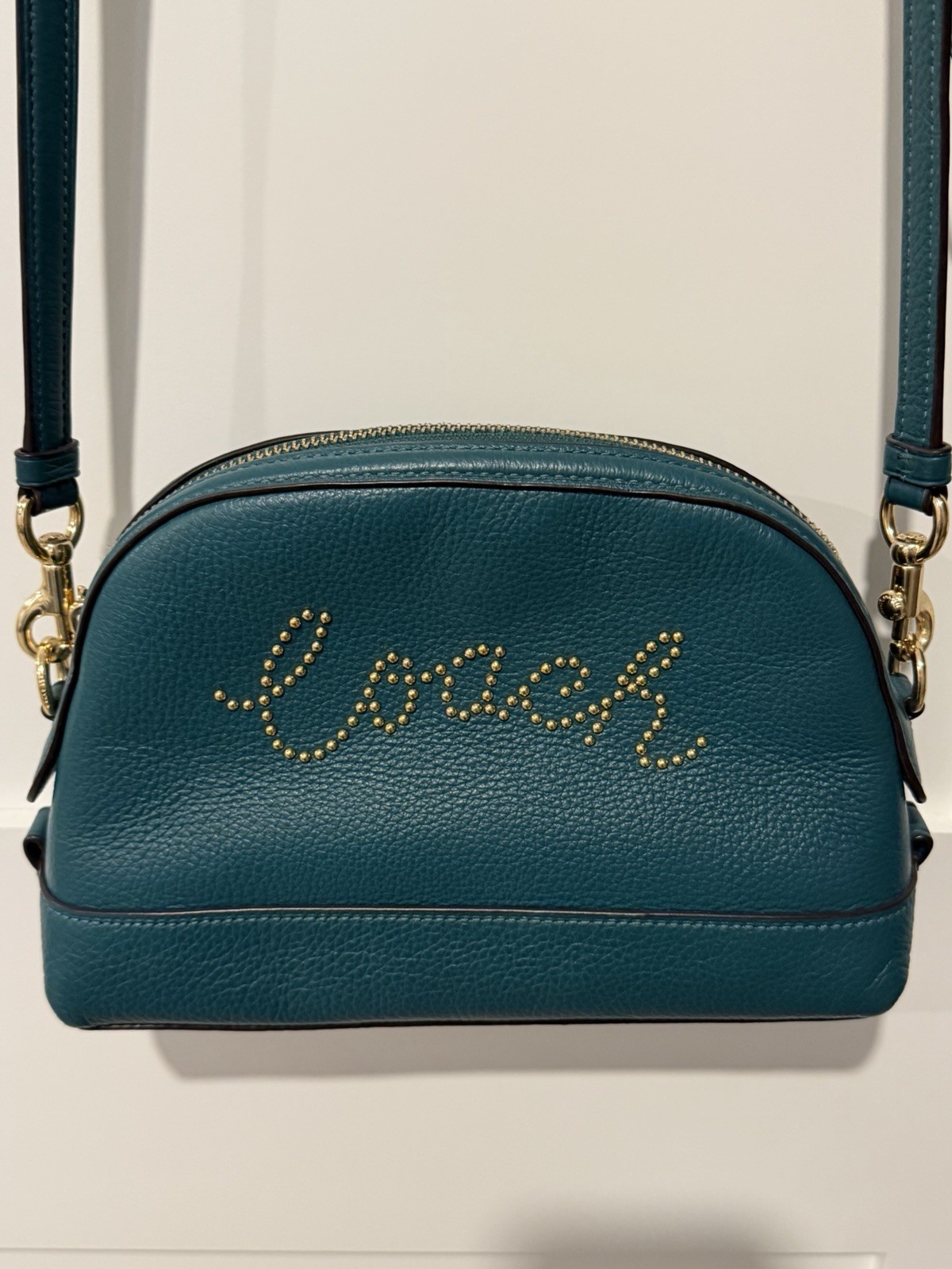 Coach teal Pebbled Leather Crossbody With Gold Studded Script Logo