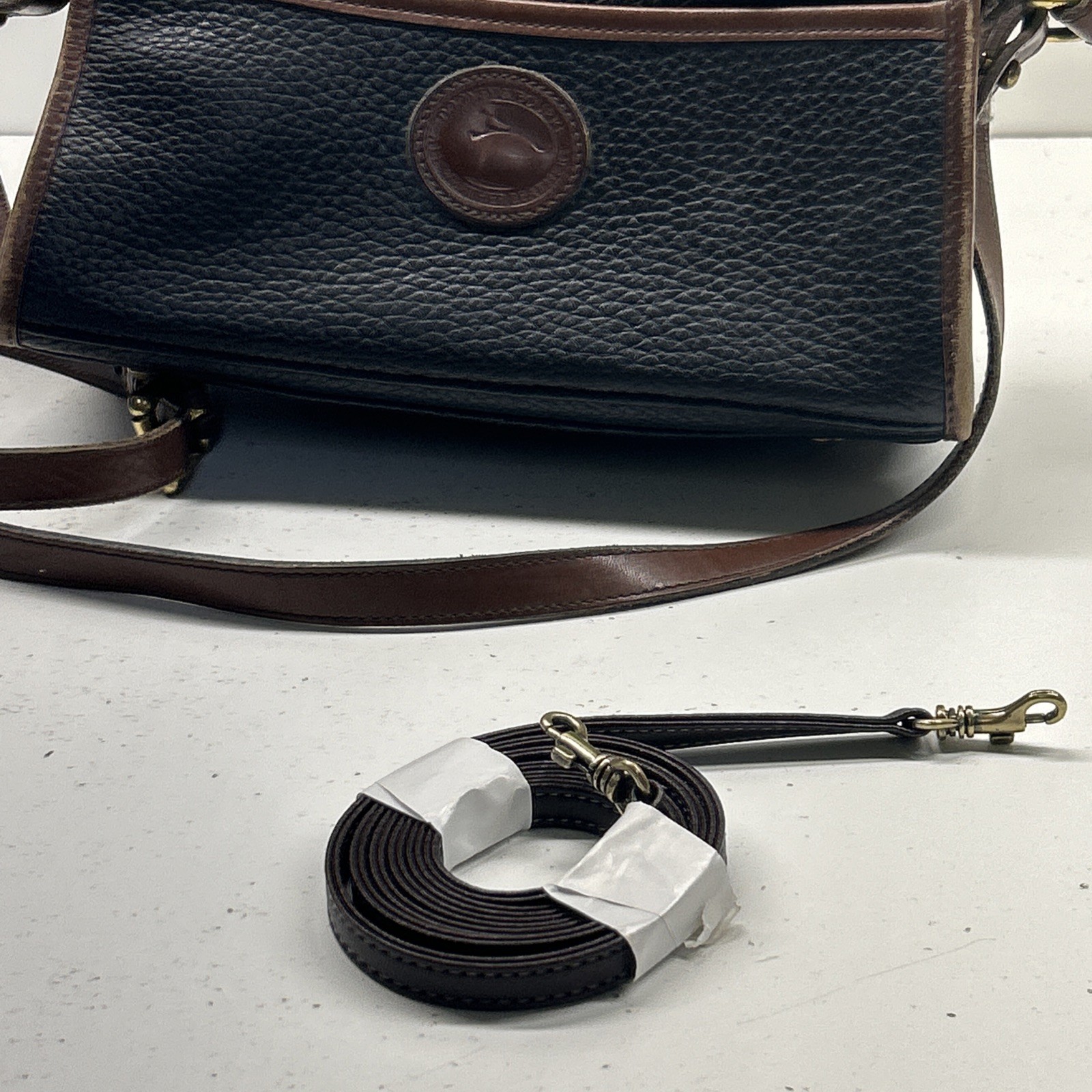 Dooney & Bourke VTG Pebbled Leather Black & British Tan Buckle Zip Crossbody Bag
