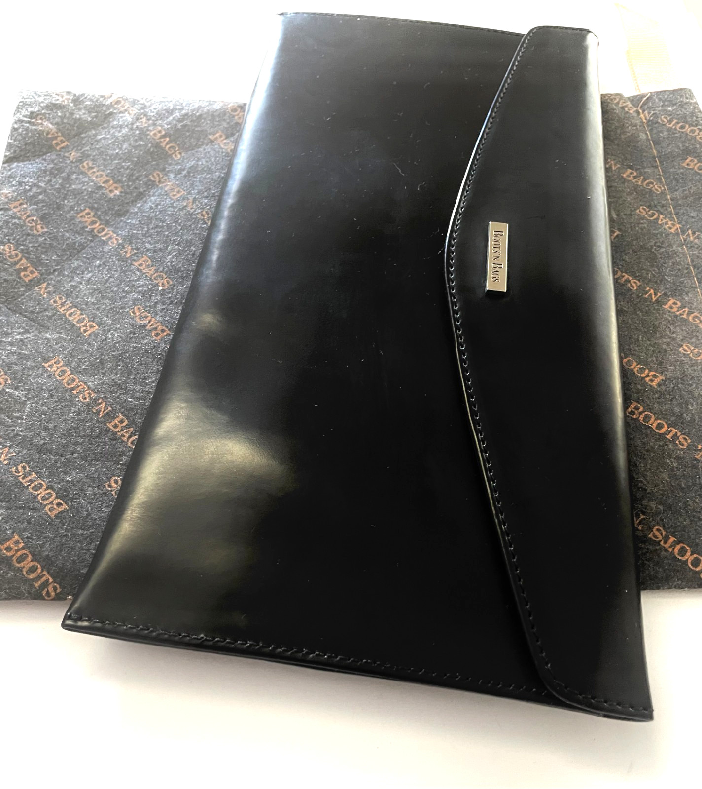 “Boots ‘N Bags” Vintage leather. Envelope, Wallet 2002. 10 1/5″ x 5 1/5″ black