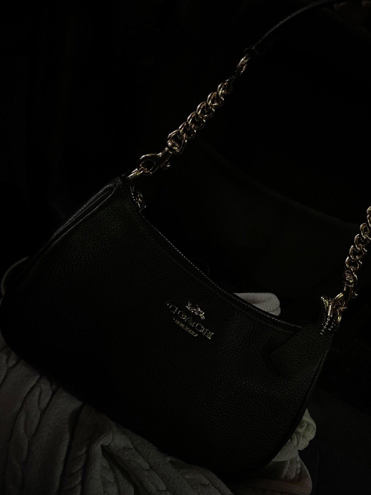 Black and gold authentic Coach shoulder bag. No smell, spacious and looks new!
